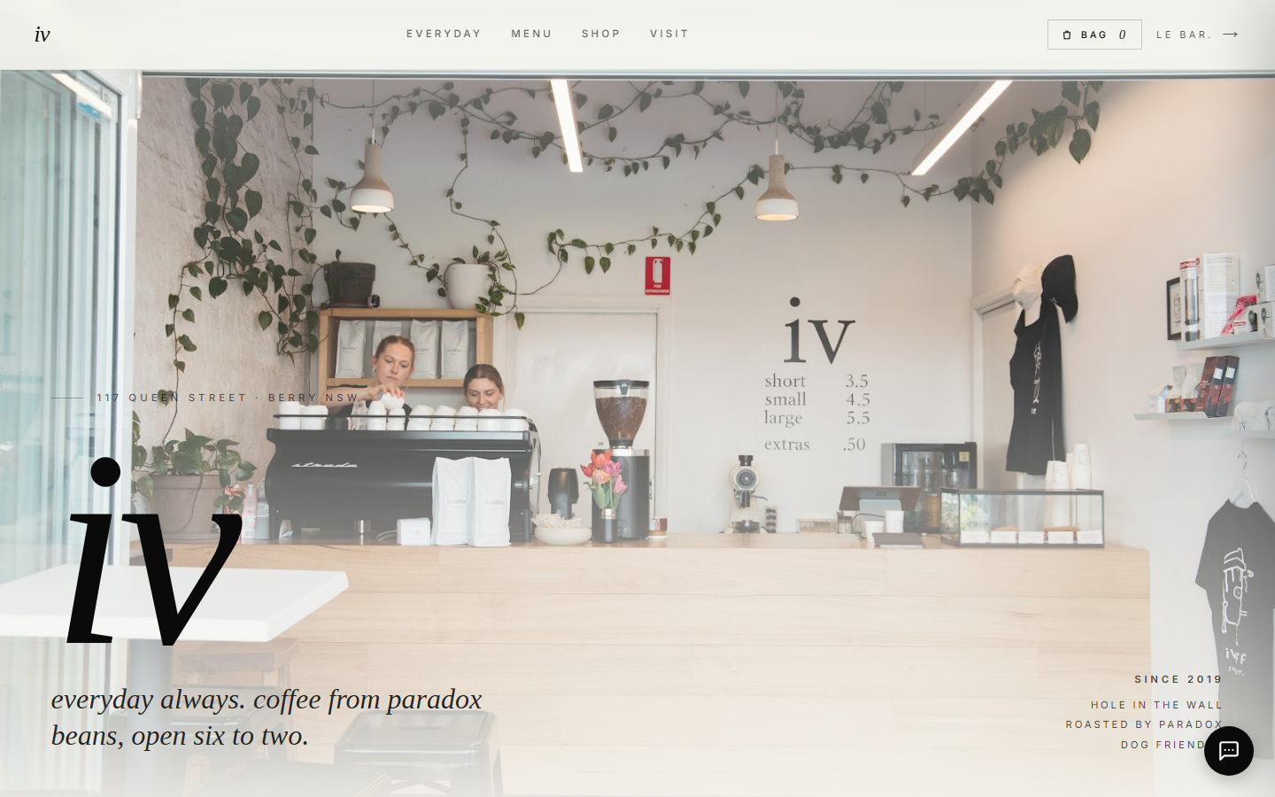 The iv coffee homepage, showing the cafe interior behind a large serif logo.