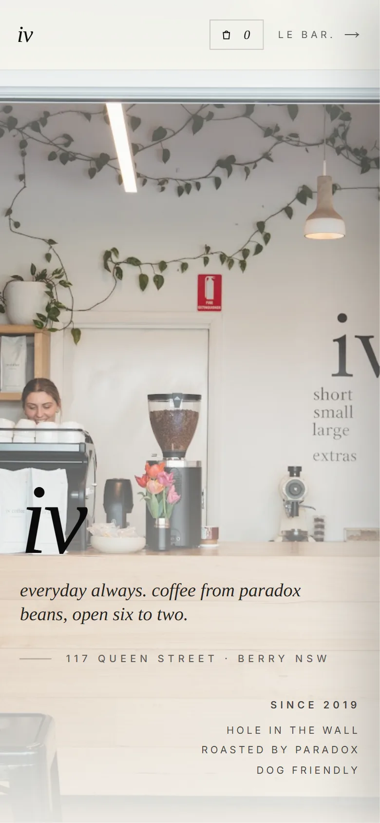 The iv coffee homepage on a phone, with the cafe counter, the address and the opening hours.